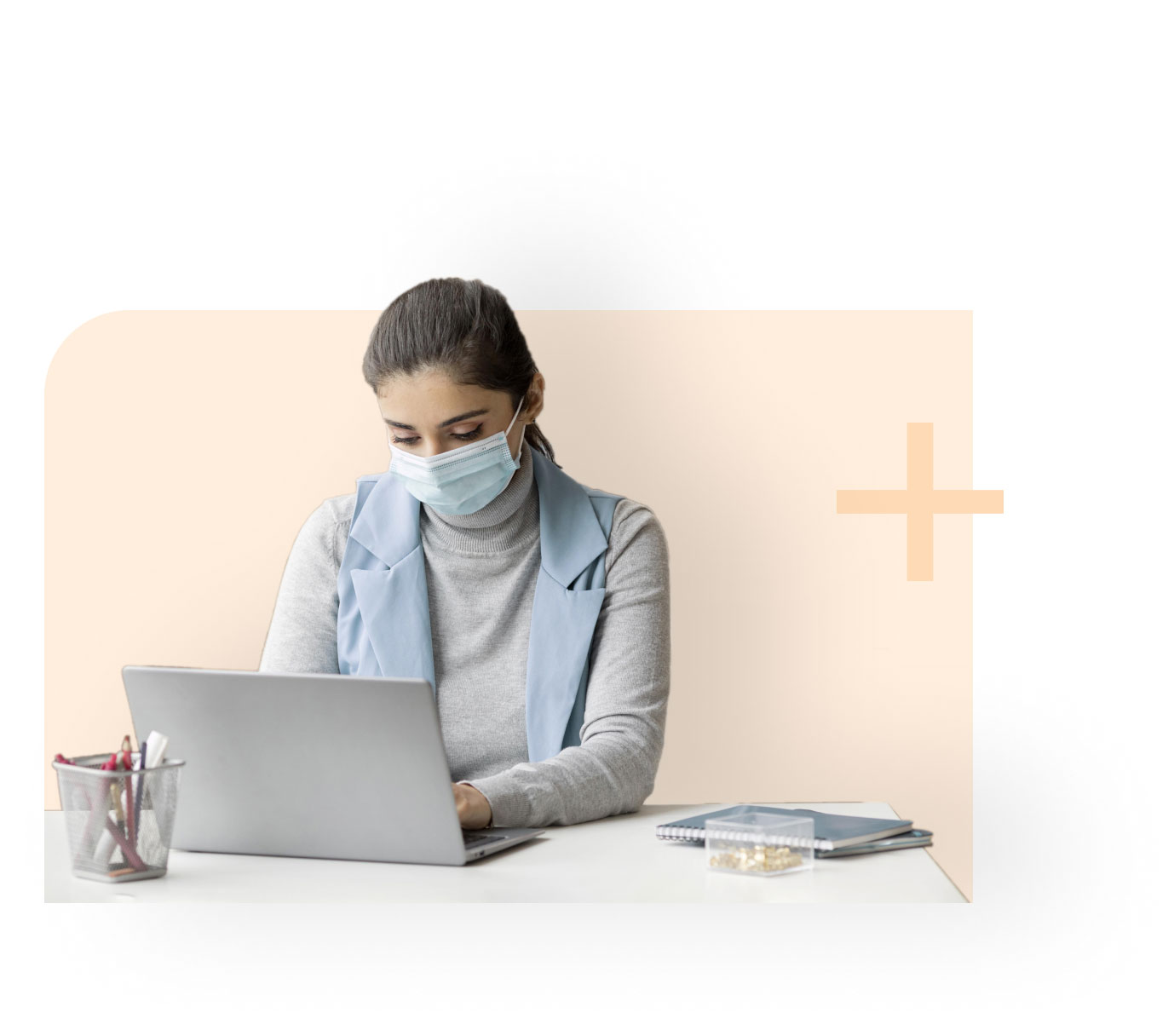 Healthcare professional working on computer

